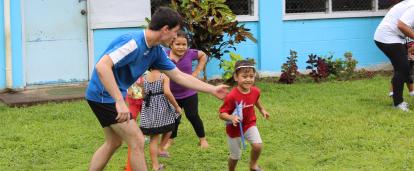 Volunteer teaches children rugby exercises on the Samoa Sports Coaching Project Projects Abroad volunteer teaches children rugby exercises on the Samoa Sports Coaching Project